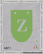 A taped needlepoint canvas with the design: Banner 18 mesh count Rounded Z White on Light Green.