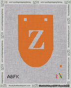 A taped needlepoint canvas with the design: Banner 18 mesh count Rounded Z White on Orange.