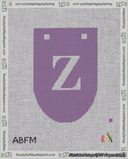 A taped needlepoint canvas with the design: Banner 18 mesh count Rounded Z White on Purple.
