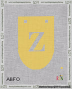 A taped needlepoint canvas with the design: Banner 18 mesh count Rounded Z White on Yellow.