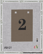 A taped needlepoint canvas with the design: Banner 18 mesh count Squared 2 Black on Brown.