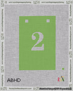 A taped needlepoint canvas with the design: Banner 18 mesh count Squared 2 White on Light Green.