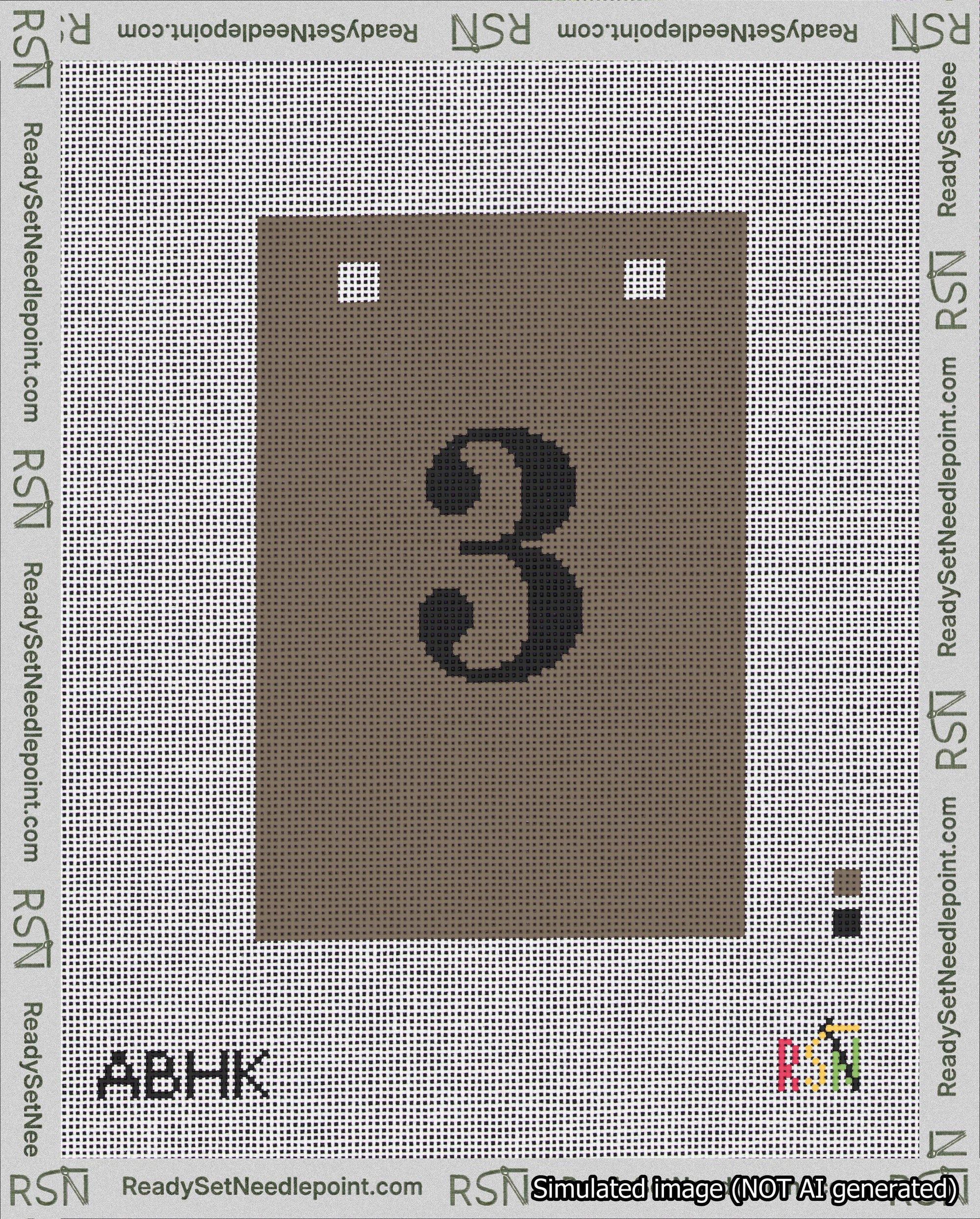 A taped needlepoint canvas with the design: Banner 18 mesh count Squared 3 Black on Brown.