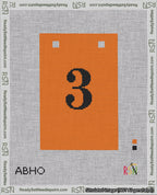 A taped needlepoint canvas with the design: Banner 18 mesh count Squared 3 Black on Orange.