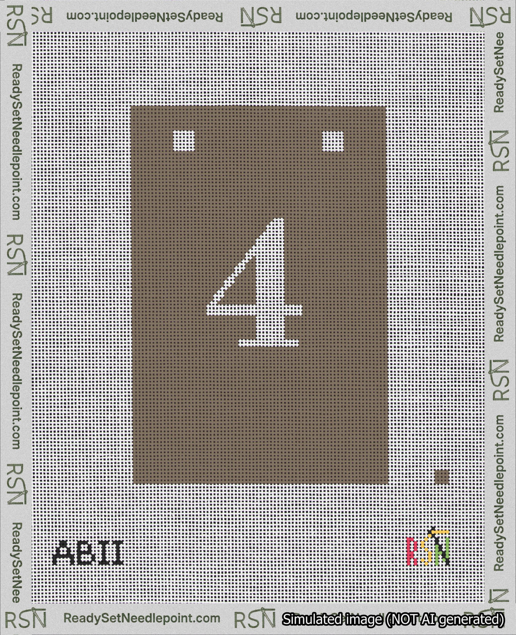 A taped needlepoint canvas with the design: Banner 18 mesh count Squared 4 White on Brown.