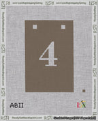 A taped needlepoint canvas with the design: Banner 18 mesh count Squared 4 White on Brown.