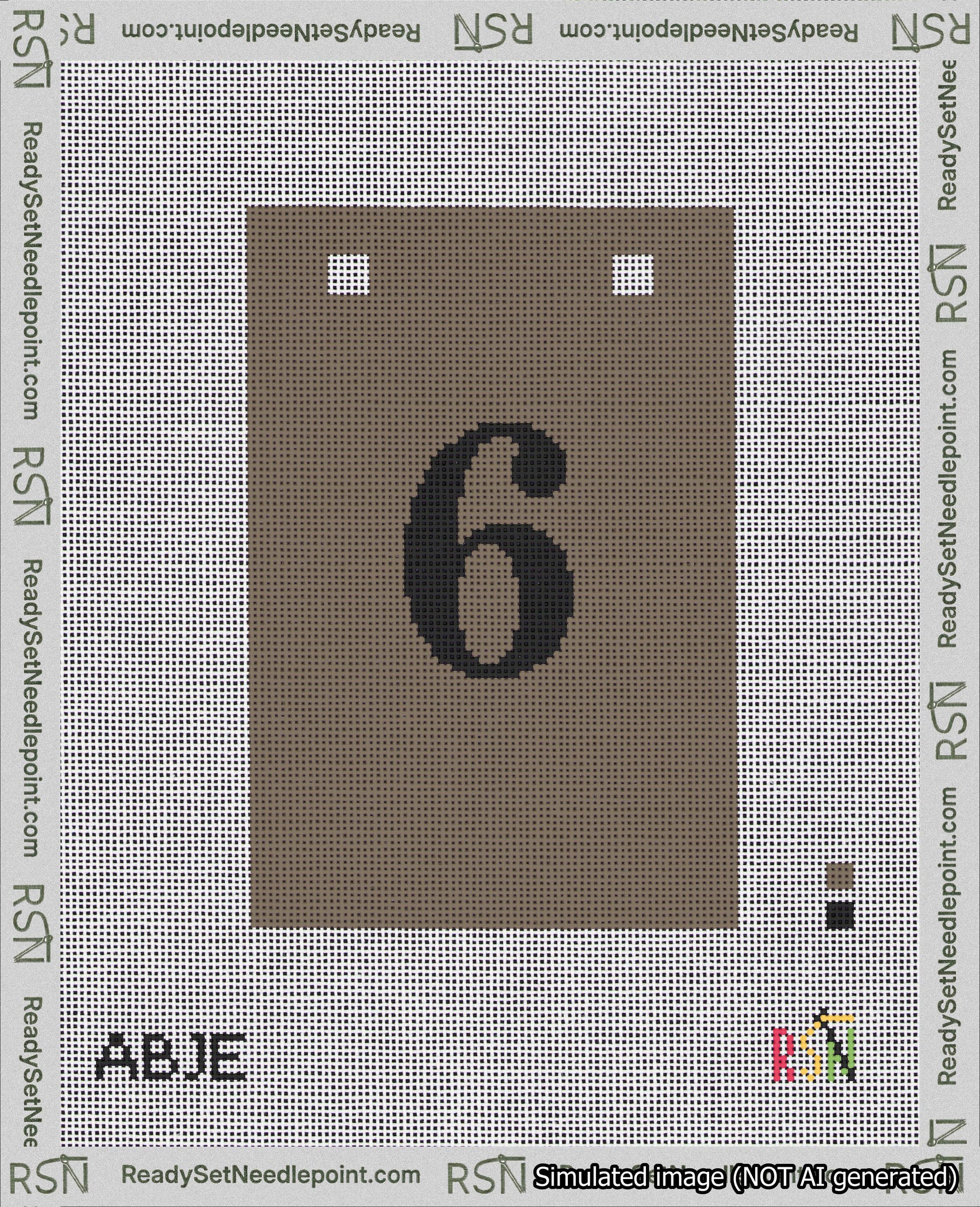 A taped needlepoint canvas with the design: Banner 18 mesh count Squared 6 Black on Brown.