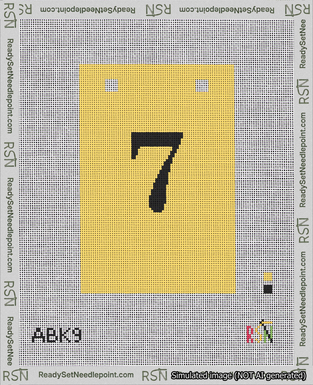 A taped needlepoint canvas with the design: Banner 18 mesh count Squared 7 Black on Yellow.