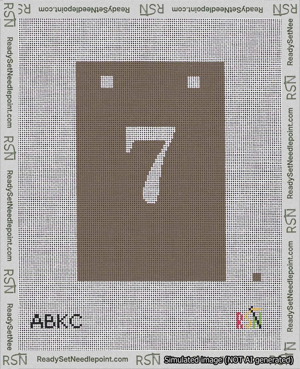 A taped needlepoint canvas with the design: Banner 18 mesh count Squared 7 White on Brown.