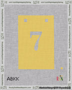A taped needlepoint canvas with the design: Banner 18 mesh count Squared 7 White on Yellow.