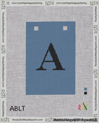 A taped needlepoint canvas with the design: Banner 18 mesh count Squared A Black on Blue.