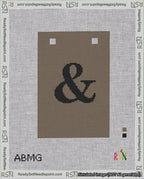 A taped needlepoint canvas with the design: Banner 18 mesh count Squared Ampersand Black on Brown.