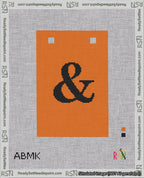 A taped needlepoint canvas with the design: Banner 18 mesh count Squared Ampersand Black on Orange.