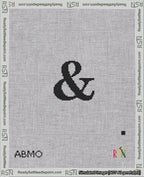 A taped needlepoint canvas with the design: Banner 18 mesh count Squared Ampersand Black on White.