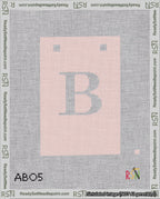 A taped needlepoint canvas with the design: Banner 18 mesh count Squared B White on Pink.