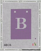 A taped needlepoint canvas with the design: Banner 18 mesh count Squared B White on Purple.