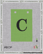 A taped needlepoint canvas with the design: Banner 18 mesh count Squared C Black on Light Green.