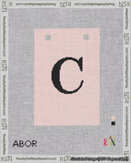 A taped needlepoint canvas with the design: Banner 18 mesh count Squared C Black on Pink.