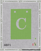 A taped needlepoint canvas with the design: Banner 18 mesh count Squared C White on Light Green.