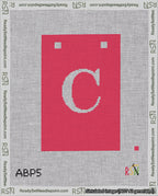 A taped needlepoint canvas with the design: Banner 18 mesh count Squared C White on Red.