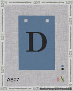 A taped needlepoint canvas with the design: Banner 18 mesh count Squared D Black on Blue.