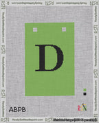 A taped needlepoint canvas with the design: Banner 18 mesh count Squared D Black on Light Green.
