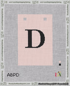 A taped needlepoint canvas with the design: Banner 18 mesh count Squared D Black on Pink.