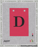 A taped needlepoint canvas with the design: Banner 18 mesh count Squared D Black on Red.