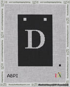 A taped needlepoint canvas with the design: Banner 18 mesh count Squared D White on Black.