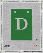 A taped needlepoint canvas with the design: Banner 18 mesh count Squared D White on Green.