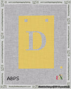A taped needlepoint canvas with the design: Banner 18 mesh count Squared D White on Yellow.