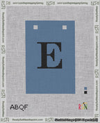 A taped needlepoint canvas with the design: Banner 18 mesh count Squared E Black on Blue.