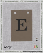 A taped needlepoint canvas with the design: Banner 18 mesh count Squared E Black on Brown.