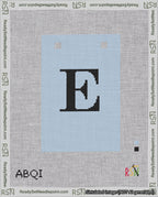 A taped needlepoint canvas with the design: Banner 18 mesh count Squared E Black on Light Blue.