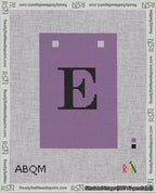 A taped needlepoint canvas with the design: Banner 18 mesh count Squared E Black on Purple.