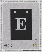 A taped needlepoint canvas with the design: Banner 18 mesh count Squared E White on Black.