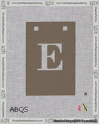 A taped needlepoint canvas with the design: Banner 18 mesh count Squared E White on Brown.