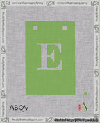 A taped needlepoint canvas with the design: Banner 18 mesh count Squared E White on Light Green.