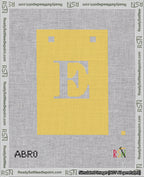 A taped needlepoint canvas with the design: Banner 18 mesh count Squared E White on Yellow.