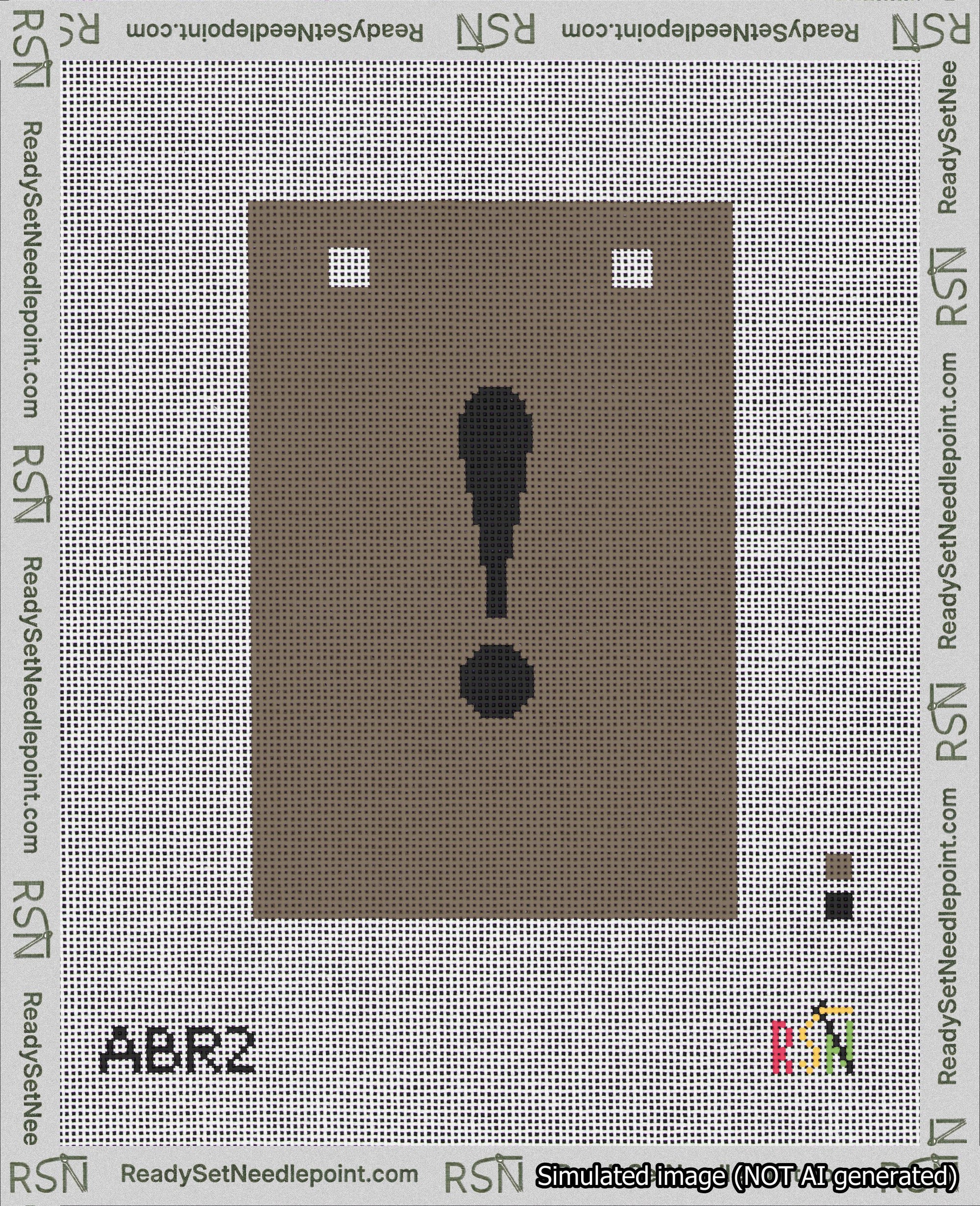A taped needlepoint canvas with the design: Banner 18 mesh count Squared Exclamation Black on Brown.