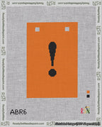 A taped needlepoint canvas with the design: Banner 18 mesh count Squared Exclamation Black on Orange.