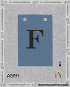 A taped needlepoint canvas with the design: Banner 18 mesh count Squared F Black on Blue.
