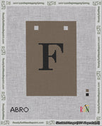 A taped needlepoint canvas with the design: Banner 18 mesh count Squared F Black on Brown.
