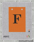 A taped needlepoint canvas with the design: Banner 18 mesh count Squared F Black on Orange.