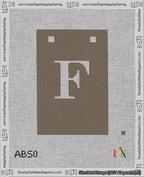 A taped needlepoint canvas with the design: Banner 18 mesh count Squared F White on Brown.