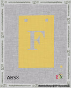 A taped needlepoint canvas with the design: Banner 18 mesh count Squared F White on Yellow.