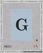 A taped needlepoint canvas with the design: Banner 18 mesh count Squared G Black on Light Blue.