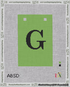 A taped needlepoint canvas with the design: Banner 18 mesh count Squared G Black on Light Green.