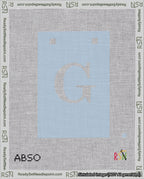 A taped needlepoint canvas with the design: Banner 18 mesh count Squared G White on Light Blue.