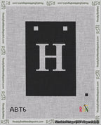 A taped needlepoint canvas with the design: Banner 18 mesh count Squared H White on Black.